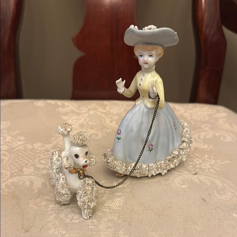 MCM 1950s ceramic woman walking spaghetti poodle on chain, gold accents